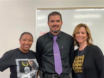 2 females teacher and a male teacher in the middle