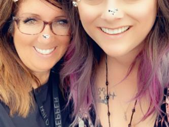a snapchat selfie with filtered ears of  2 teachers 