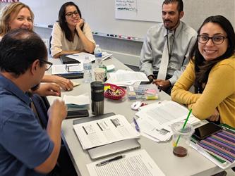 teachers working together in a group setting 