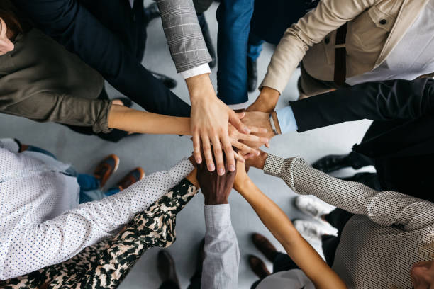 Hands coming together in a circle
